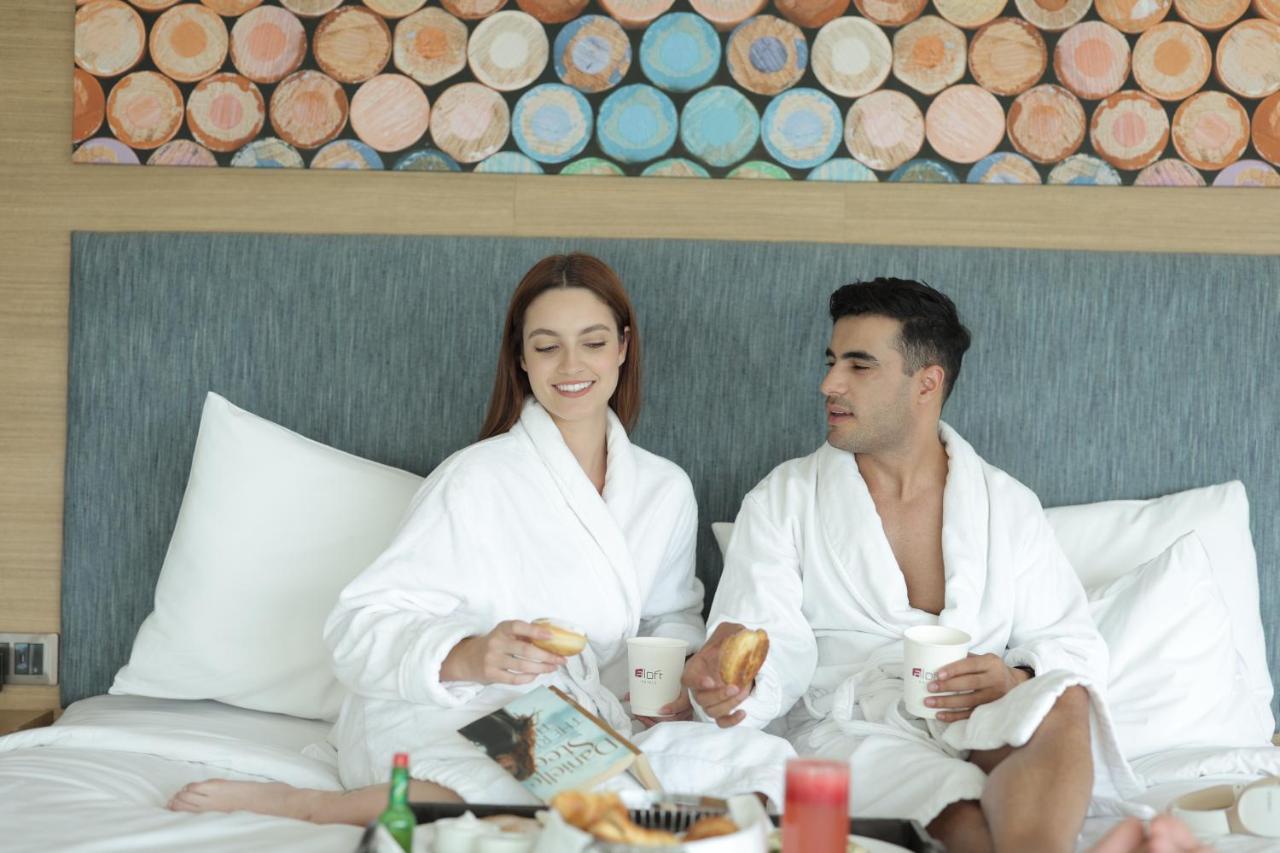 Aloft New Delhi Aerocity Εξωτερικό φωτογραφία A couple wearing bathrobes